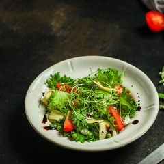 salad vegetables - tomato, lettuce, cheese, microgreen and salad dressing. food background. top