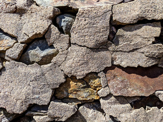 Old concrete and rock wall in the early morning light