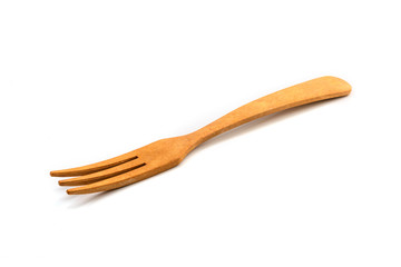 Fork made of wood on a white background