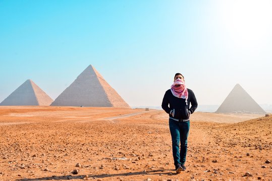 man standing in Pyramid of Giza during daytime
