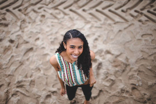 woman standing on beige sand