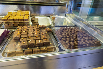 Cakes with the price of the glass in a candy store