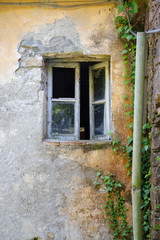 Old window of an abandoned house 