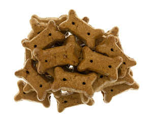 Pile of peanut butter dog biscuits on a white background top view.