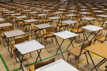 Exam tables set up in a sports hall for exams in a high school & sixth form
