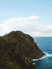 Fototapeta na wymiar Hidden lighthouse in top of a cliff