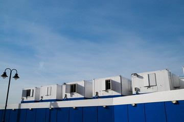 Blue and white builder's huts.