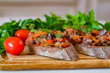 Close up home made aubergine pate or spread on rye bread