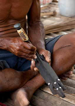 Man Carving A Wood Statue, Trobriand Island, Papua New Guinea