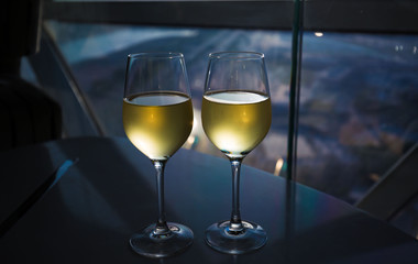 UAE. White wine in window background