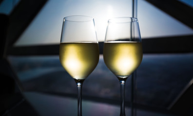 UAE. White wine in window background