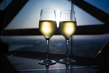 UAE. White wine in window background