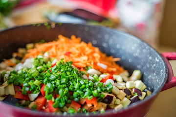 Chopped fresh vegetables in saucepan. Cooking vegetables