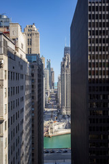 View of Michigan Ave "Magnificent Mile" in Chicago seen from between two high-rise buildings.