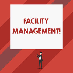 Writing note showing Facility Management. Business concept for Multiple Function Discipline Environmental Maintenance Isolated view man standing pointing upwards two hands big rectangle