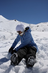 Fototapeta na wymiar woman playing on the snow