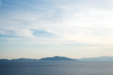 Beautiful mysterious nature background with of the ocean against the misty mountains