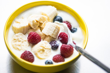 Morning breakfast set with bowl of fruits apples and blueberry.