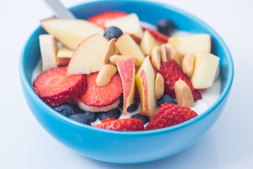 Morning breakfast set with bowl of fruits apples and blueberry.
