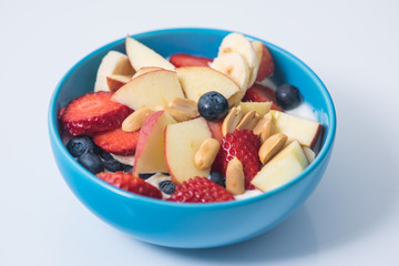 Morning breakfast set with bowl of fruits apples and blueberry.