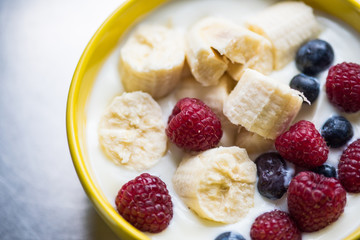 Morning breakfast set with bowl of fruits apples and blueberry.
