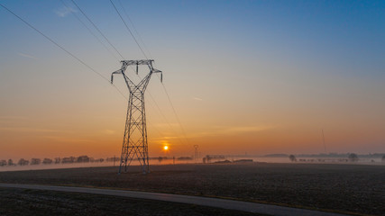 Fototapeta na wymiar electric line at sunrise 