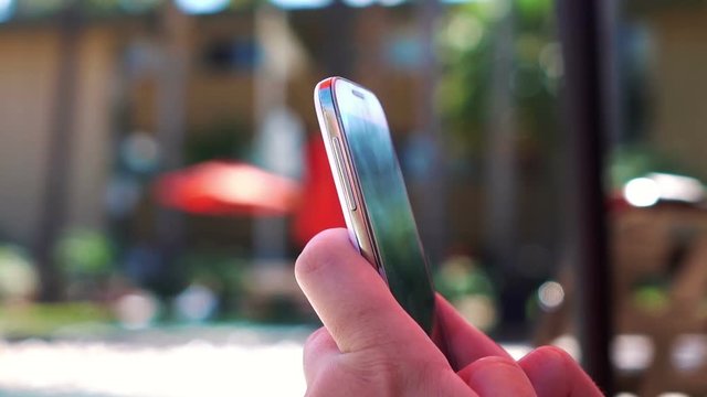 Woman using phone on the vacations in slow motion 120fps