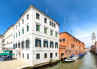 Fototapeta na wymiar Venetian canal in sunny day. Italy.