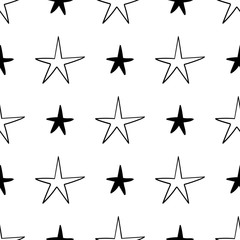 Seamless stars pattern. Hand drawn star doodles texture background.