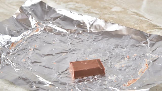 Stop motion animation of a chocolate bar vanishing, 4k