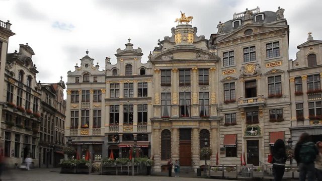 BRUSSELS, BELGIUM - SEPTEMBER 15, 2013: L'&Eacute;toile, Le Cygne, L'Arbre d'Or, La Rose and Le Mont Thabor Gothic architecture in Grand Place of Brussels, timelapse