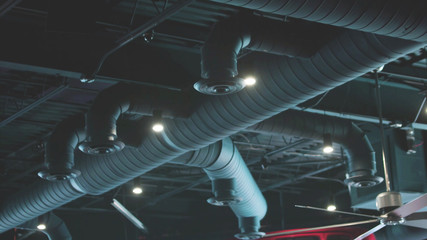 tubes of air conditioning system in the roof of building - 271837099