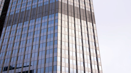 Fototapeta na wymiar Eurotower building Frankfurt am Main with cloudy white sky background in germany.