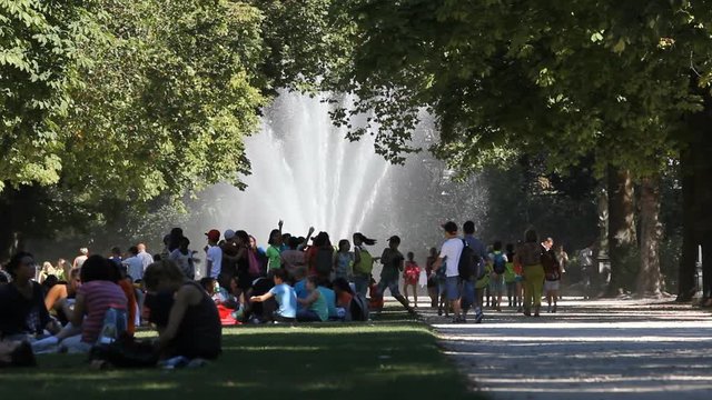 BRUSSELS, BELGIUM - SEPTEMBER 15, 2013: Park crowded with people during summer day