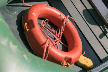 Orange life buoy on the boat. Concept for rescue drowning
