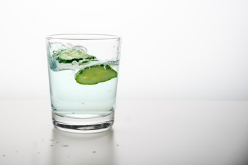 Minimalism. Clean water with cucumber with copy space. detox of the body