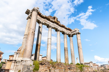 Temple of Saturn - ruins with old historical columns. Roman Forum archeological site, Rome, Italy