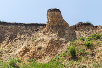 Landslide zone on Black Sea coast. Rock of sea rock shell. Zone of natural disasters during rainy season. Large masses of earth slip along slope of hill, destroy houses. Landslide - threat to life