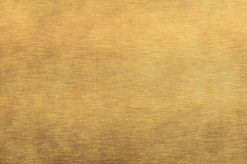 Brushed gold metal texture.