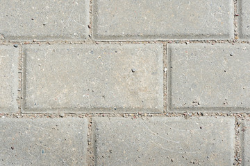 Obraz premium Gray paving slabs texture close up. Paving slabs background