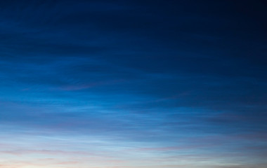 Noctilucent clouds on sunset.