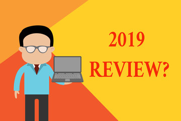 Handwriting text 2019 Review Question. Conceptual photo remembering past year events main actions or good shows Standing man in suit wearing eyeglasses holding open laptop photo Art