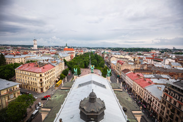 Fototapeta na wymiar Wiew on sculptures on roof of Lviv Opera House