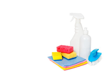 Different kinds of house cleaners and colorful sponges, gloves isolated on white. Cleaning background. Front view. Horizontal composition.