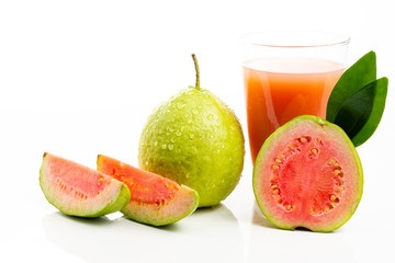 Guava juice and peeled fruit on white background.