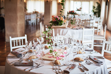 Beautifully decorated tables for guests with decorations in a restaurant.