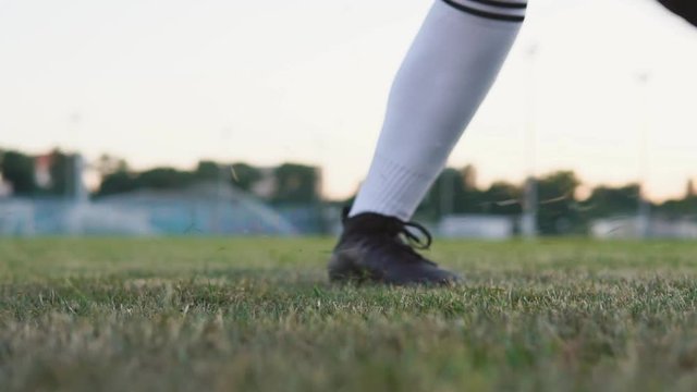Close up of female soccer player kicking the ball at the goal, slow motion