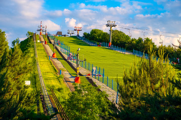 Warsaw, Poland - Panoramic view of the Szczesliwicka Hill - artificial hill serving as a ski slope - in Szczesliwicki Park - one of the largest public parks in Warsaw - obrazy, fototapety, plakaty