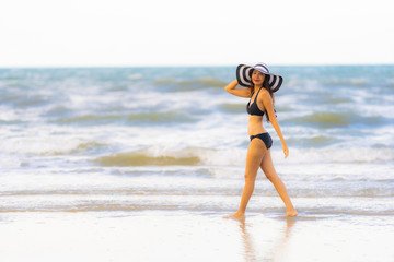 Portrait beautiful young asian woman wear bikini on the beach sea ocean