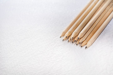 Wooden pencils isolated on white background corrugated and spotted